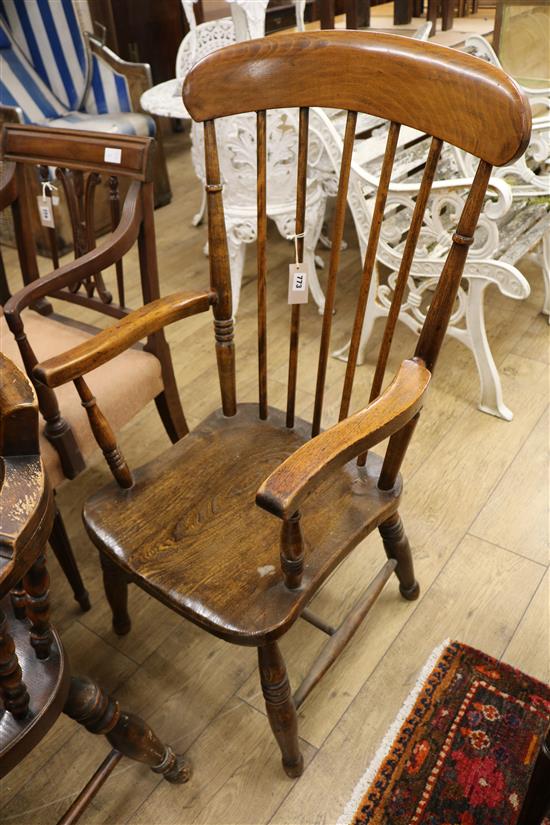 A Victorian elm and beech comb-back elbow chair